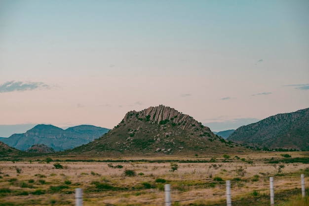 scenic view of landscape and mountains against sky
