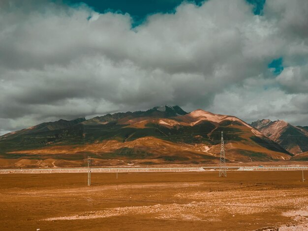 Scenic view of landscape and mountains against sky