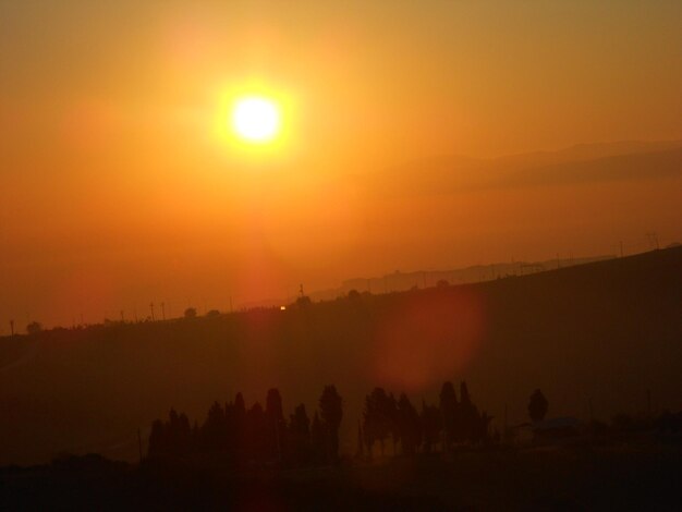 Scenic view of landscape at sunset