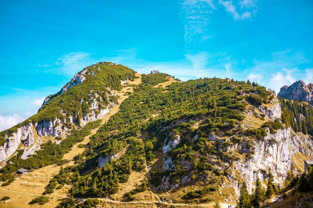 Scenic view of mountain against blue sky