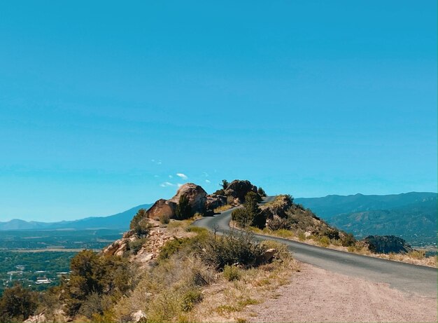 Scenic view of mountain against clear blue sky