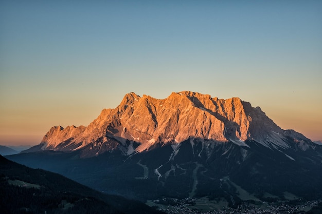 Scenic view of mountain against clear sky during sunset