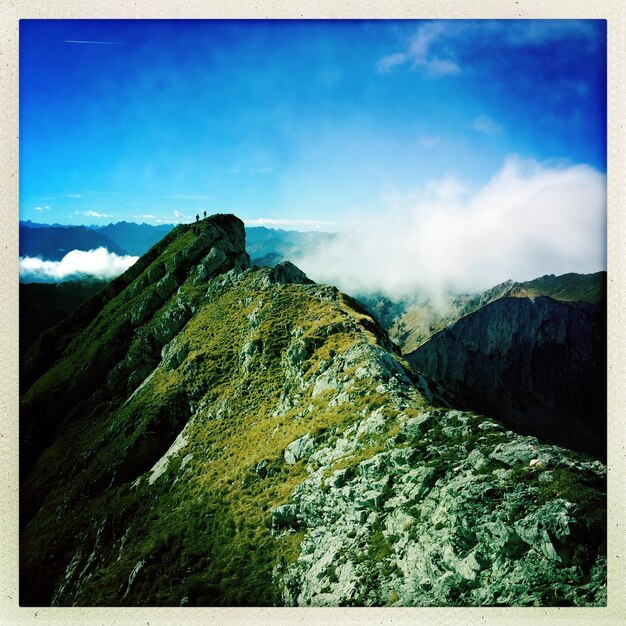 Scenic view of mountain against cloudy sky