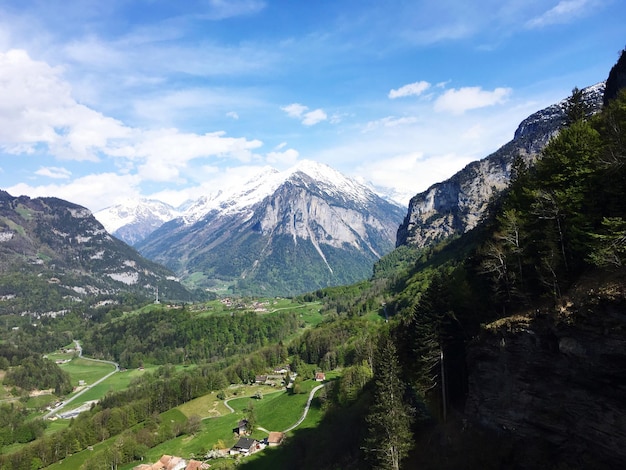 Scenic view of mountain against cloudy sky