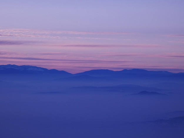 Scenic view of mountain against sky during sunset