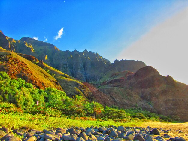 Scenic view of mountain range against blue sky