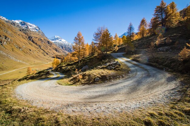 Scenic view of mountain road against blue sky