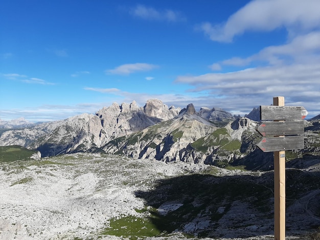 Scenic view of mountains against blue sky