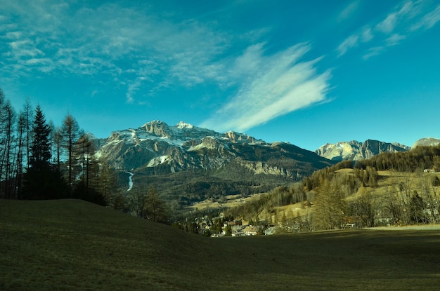 Scenic view of mountains against blue sky