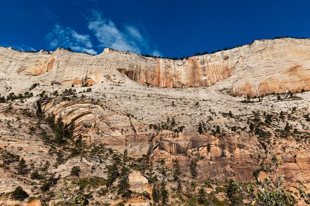 Scenic view of mountains against blue sky