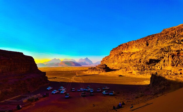 Scenic view of mountains against blue sky