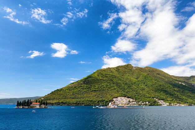 Scenic view of mountains against blue sky