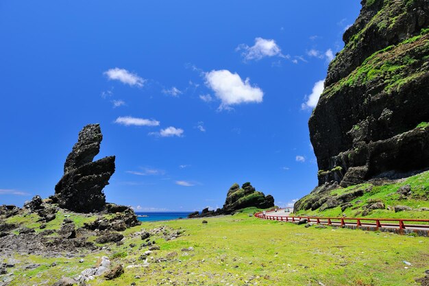 Scenic view of mountains against blue sky