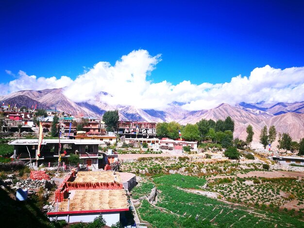 Scenic view of mountains against blue sky