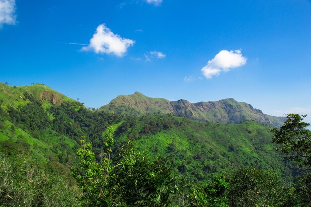 Scenic view of mountains against blue sky