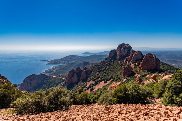 Scenic view of mountains against blue sky