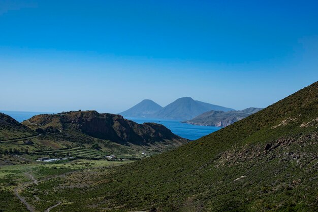 Scenic view of mountains against clear blue sky