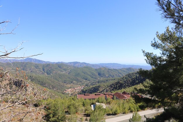 Scenic view of mountains against clear blue sky