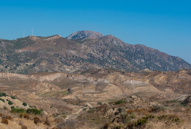 Scenic view of mountains against clear blue sky