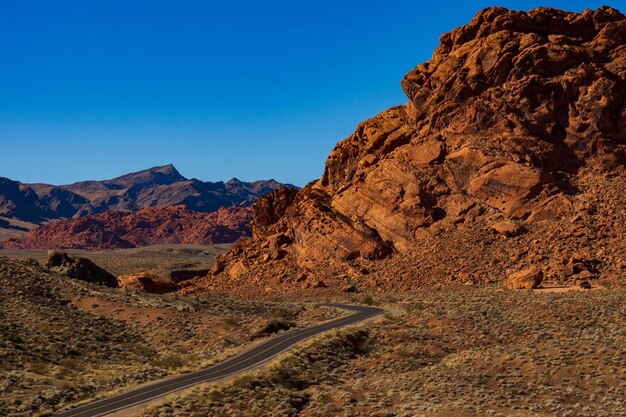 Scenic view of mountains against clear blue sky