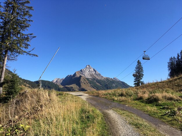 Scenic view of mountains against clear blue sky