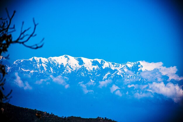 Scenic view of mountains against clear blue sky