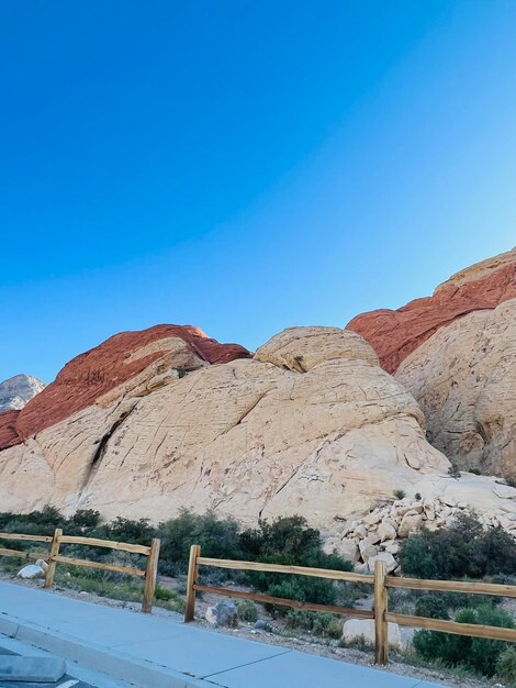 Scenic view of mountains against clear blue sky