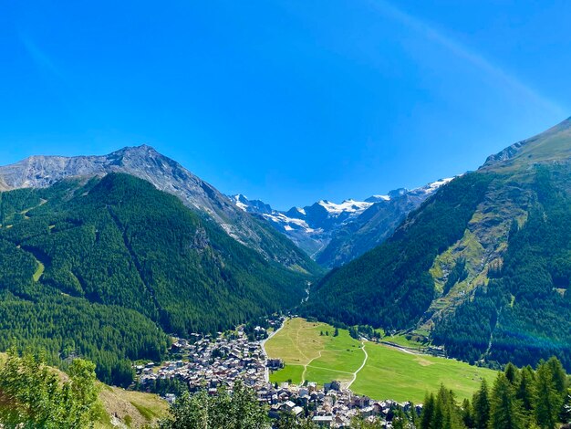 Scenic view of mountains against clear blue sky