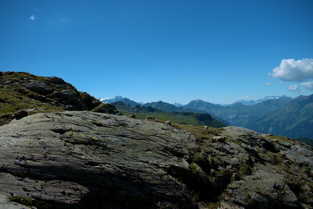 Scenic view of mountains against clear blue sky