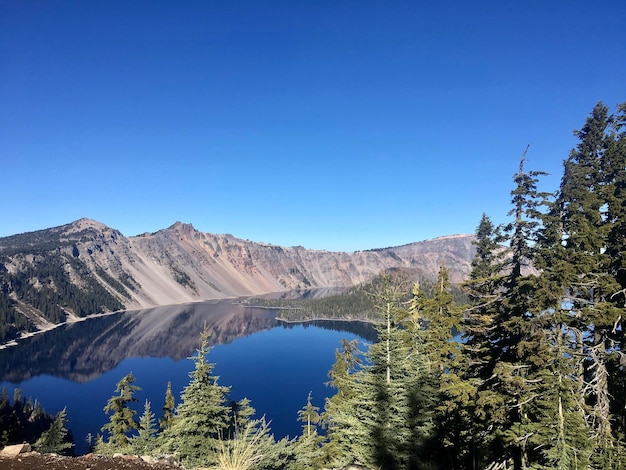 Scenic view of mountains against clear blue sky