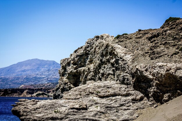 Scenic view of mountains against clear blue sky