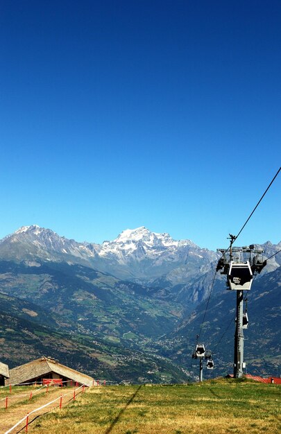 Scenic view of mountains against clear blue sky