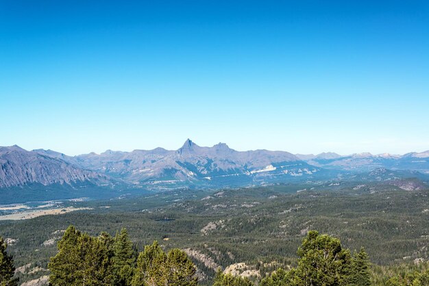 Scenic view of mountains against clear blue sky