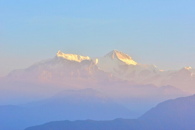 Scenic view of mountains against clear blue sky