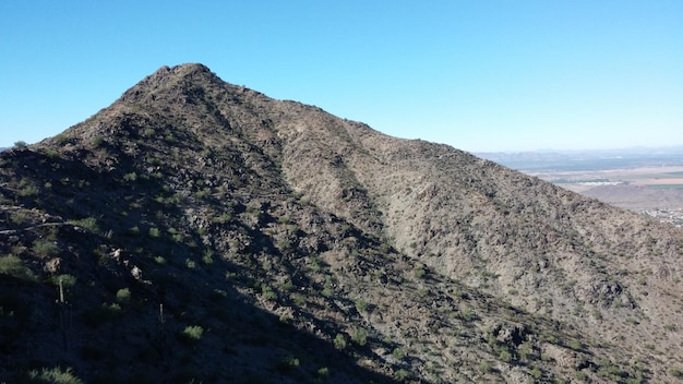 scenic view of mountains against clear blue sky