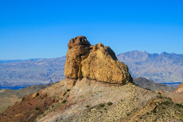 Scenic view of mountains against clear blue sky