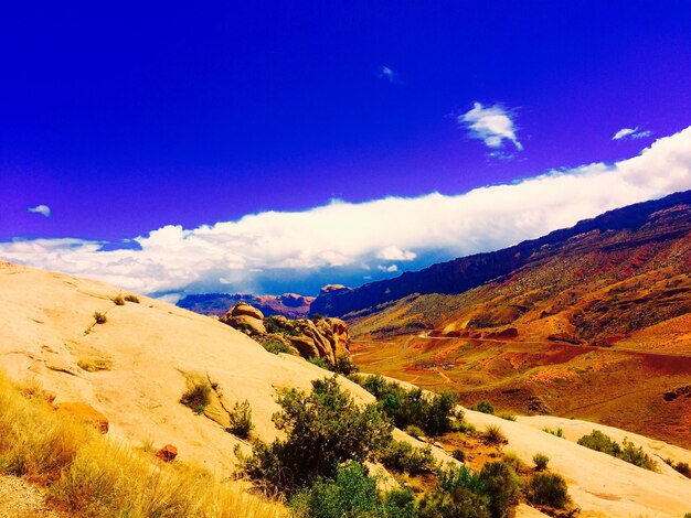 Scenic view of mountains against cloudy sky