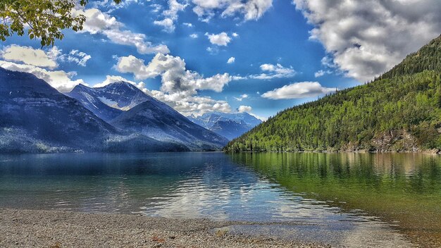 Scenic view of mountains against cloudy sky