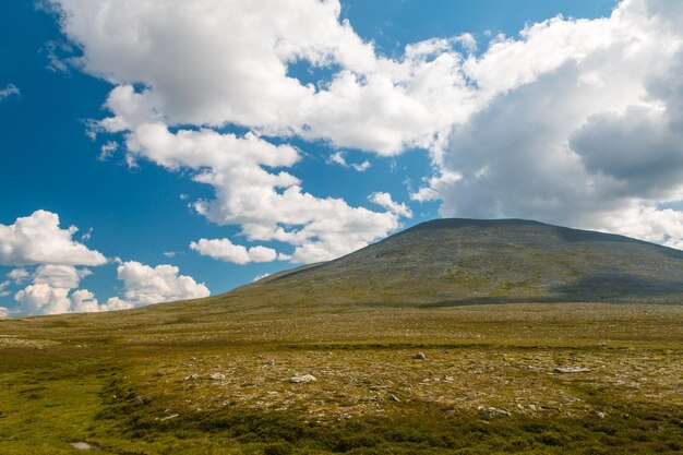 Scenic view of mountains against cloudy sky