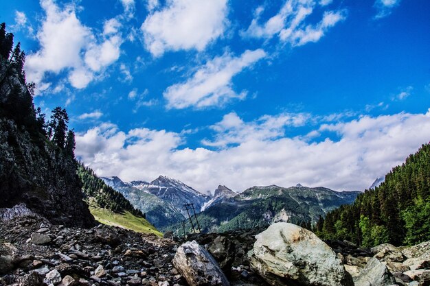 Scenic view of mountains against cloudy sky