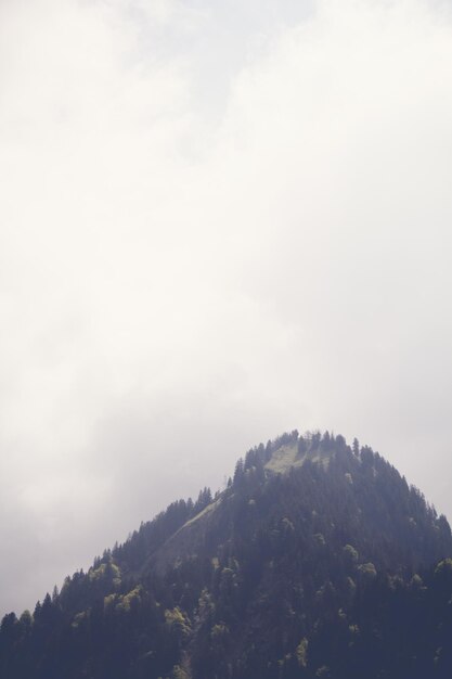 Scenic view of mountains against cloudy sky