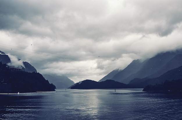 Scenic view of mountains against cloudy sky