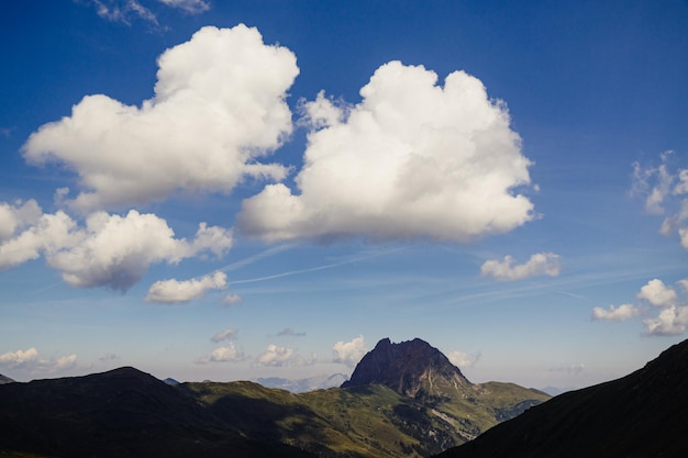 Scenic view of mountains against cloudy sky