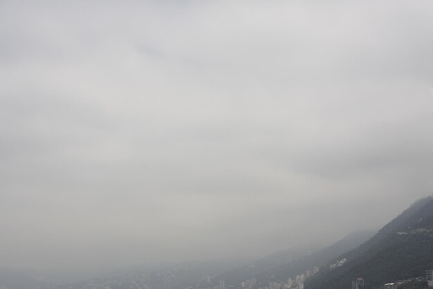 Scenic view of mountains against cloudy sky