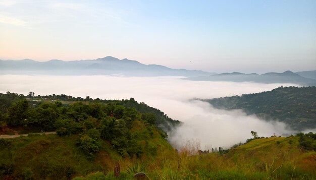 Scenic view of mountains against cloudy sky