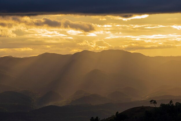 Scenic view of mountains against dramatic sky