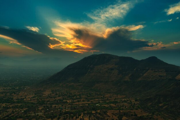 Scenic view of mountains against dramatic sky