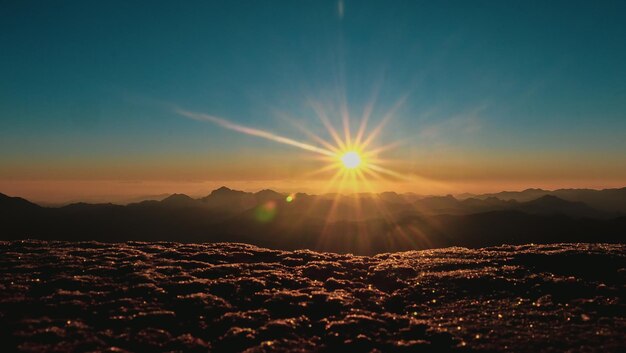 Scenic view of mountains against sky during sunset