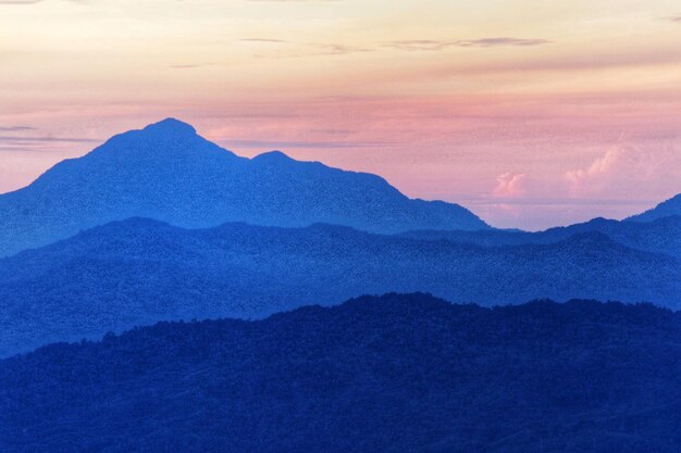 Scenic view of mountains against sky during sunset