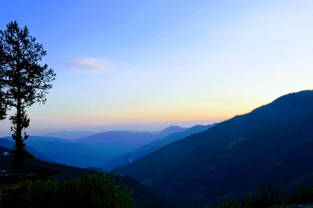 Scenic view of mountains against sky during sunset